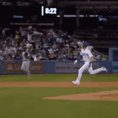 Baseball Player Running To Catch Ball, Another Watches GIF