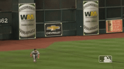 Baseball Player Running To Catch Ball In Front Of Chevrolet Sign GIF