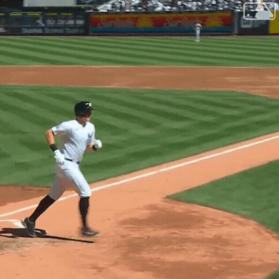 Baseball Player Running to Home