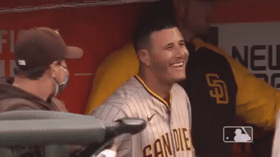 Baseball Player Smiling In Dugout, Masked Man Watching GIF