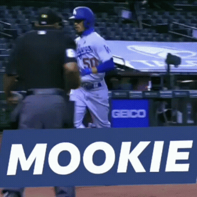 Baseball Player Standing In Front Of Mookie Sign GIF