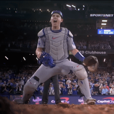 Baseball Player Standing In Front Of TD Clubhouse Sign GIF