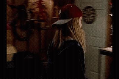Baseball Player Standing Next To Woman In Chair GIF