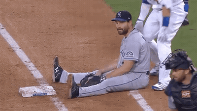 Baseball Player Stretching On Base While Catcher Watches GIF