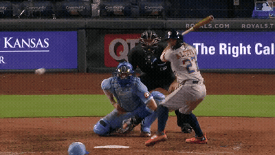Baseball Player Swinging At Ball In Front Of Kansas Ad GIF