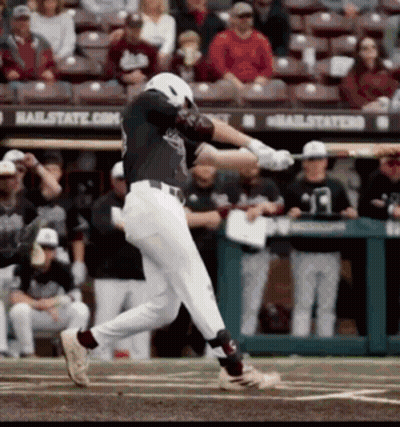 Baseball Player Swinging At Ball Near Hailstate Sign GIF