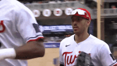 Baseball Player Swinging At Ball With Rally Sausage GIF