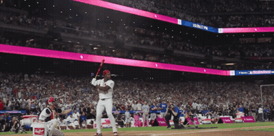 Baseball Player Swinging At Magenta Ball Sign GIF