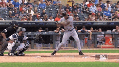 Baseball Player Swinging At Pitch Near Gatorade Sign GIF