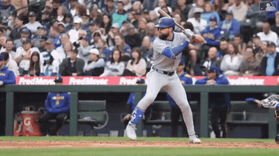 Baseball Player Swinging At Pitch Sponsored By Fred Meyer GIF