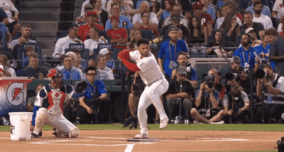 Baseball Player Swinging At Pitch With Gatorade Sign GIF