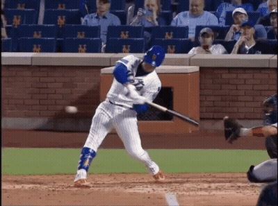 Baseball Player Swinging Bat At Ball With NY Wall GIF