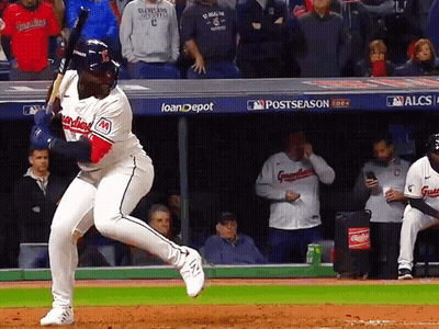Baseball Player Swinging Bat At Pitch With Loandepot Sign GIF