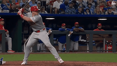 Baseball Player Swinging Bat In Front Of Crowd GIF