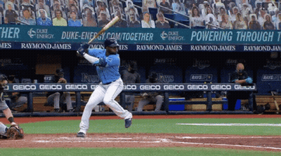 Baseball Player Swinging Bat In Front Of Duke Energy Banner GIF