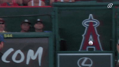 Baseball Player Swinging Bat In Front Of Lexus Sign GIF