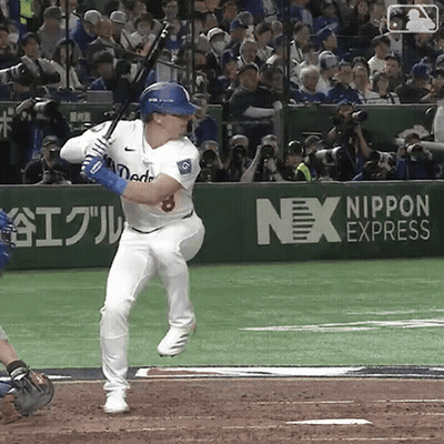Baseball Player Swinging Bat In Front Of Nex Express Ad GIF