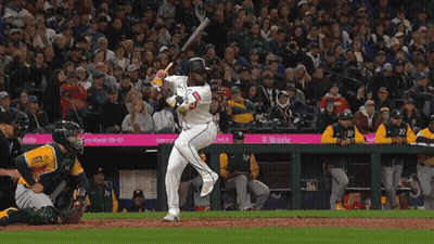 Baseball Player Swinging Bat In Front Of T-Mobile Sponsored Crowd GIF