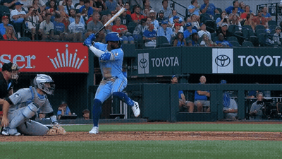 Baseball Player Swinging Bat In Front Of Toyota Ad GIF
