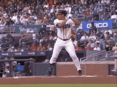 Baseball Player Swinging Bat In Stadium GIF