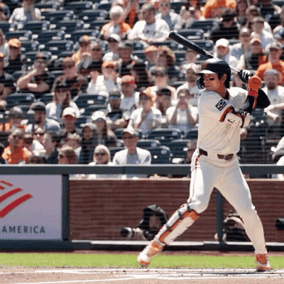 Baseball Player Swinging Bat