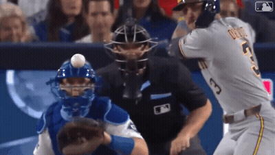 Baseball Player Swinging Bat While Catcher Watches GIF
