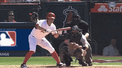 Baseball Player Swinging Bat While Catcher Watches GIF