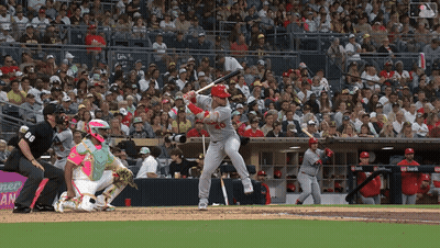 Baseball Player Swinging Bat With Catcher Watching GIF