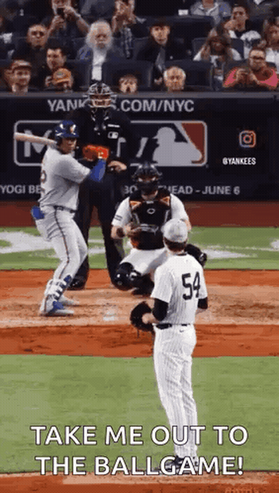 Baseball Player Swinging Bat With Pitcher On Mound GIF