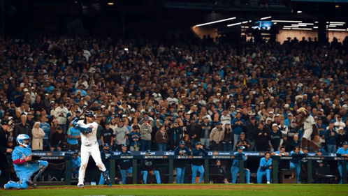 Baseball Player Swinging Bat With Playstation Crowd GIF