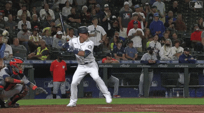 Baseball Player Swinging with Alaska on Dugout