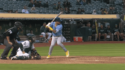 Baseball Player Swinging With Gatorade Cooler GIF