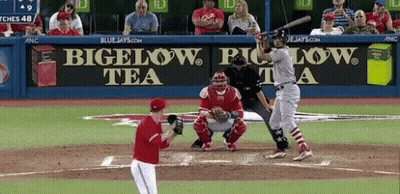 Baseball Player Swings At Pitch In Front Of Bigelow Tea Sign GIF