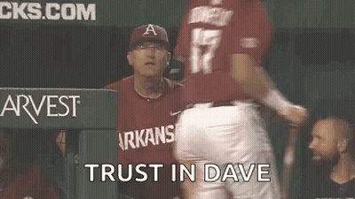 Baseball Player Talking To Coach In Dugout GIF