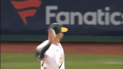 Baseball Player Throwing Ball In Front Of Fanatic Logo GIF