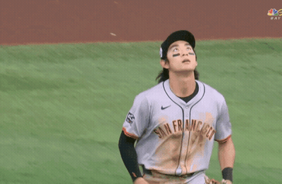 Baseball Player Throwing Ball In Front Of Sub Above Sign GIF