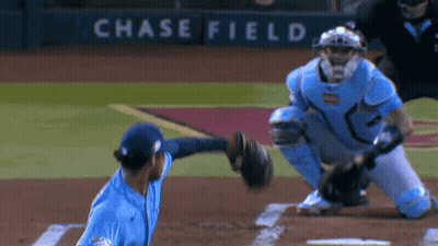 Baseball Player Throws Ball In Front Of Chase Field Sign GIF