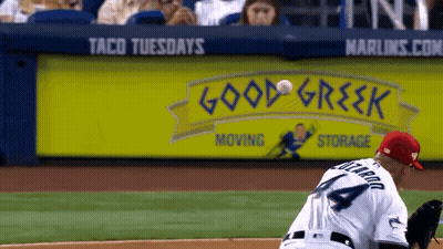 Baseball Player Throws Ball In Front Of Good Greek Sign GIF