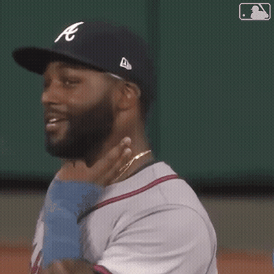 Baseball Player With Beard Smiling Holding Baby GIF