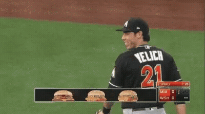 Baseball Player with M on Hat Smiling