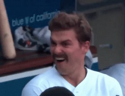 Baseball Player With Mustache Laughing In Dugout GIF