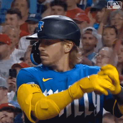 Baseball Player With Yellow Gloves And Helmet Facing Crowd GIF