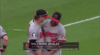 Baseball Players Hugging On Field GIF