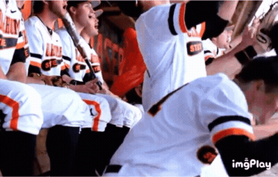Baseball Players In Dugout With Number 1 Jersey GIF