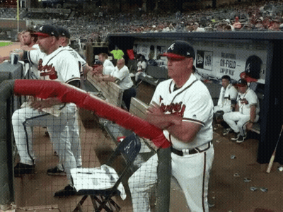 Baseball Players In Dugout With On-Field Cap Sign GIF