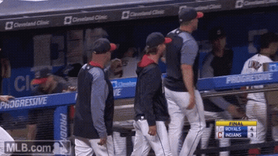 Baseball Players In Dugout With Progressive Banners GIF