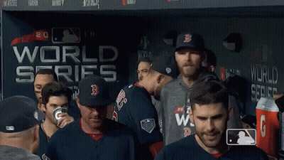 Baseball Players In Front Of World Series Wall GIF