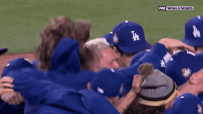 Baseball Players In LA Hats Huddling GIF