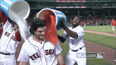 Baseball Players In Red Sox Uniforms Pouring Red Powder GIF