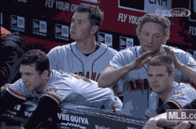 Baseball Players Sitting In Dugout GIF